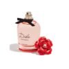 Dolce and Gabbana Dolce Rose Eau de Toilette bottle with red rose cap removed, angled view